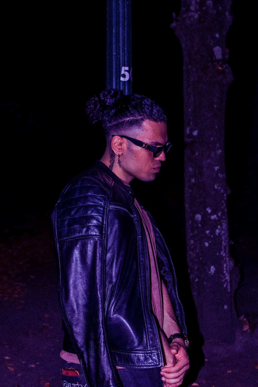 Humble leaning on lamp post